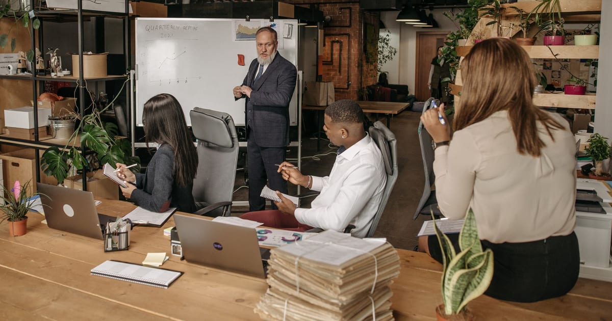 Diverse team discussing strategies in a contemporary office.