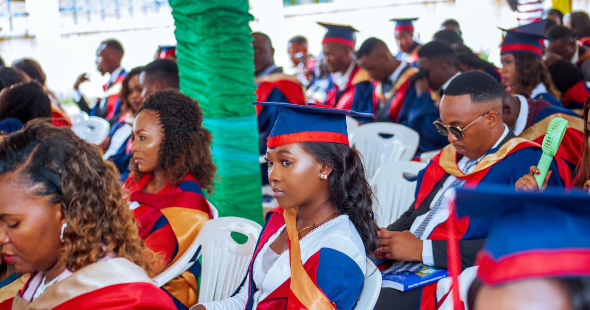 Students in caps and gowns attending a graduation ceremony, showcasing diversity and education.